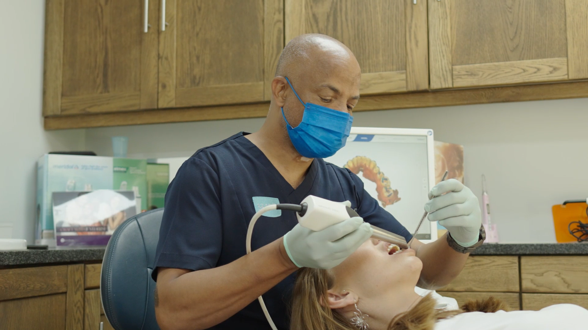 A dentist at Smile @ Kyalami examining a patient during a routine check-up