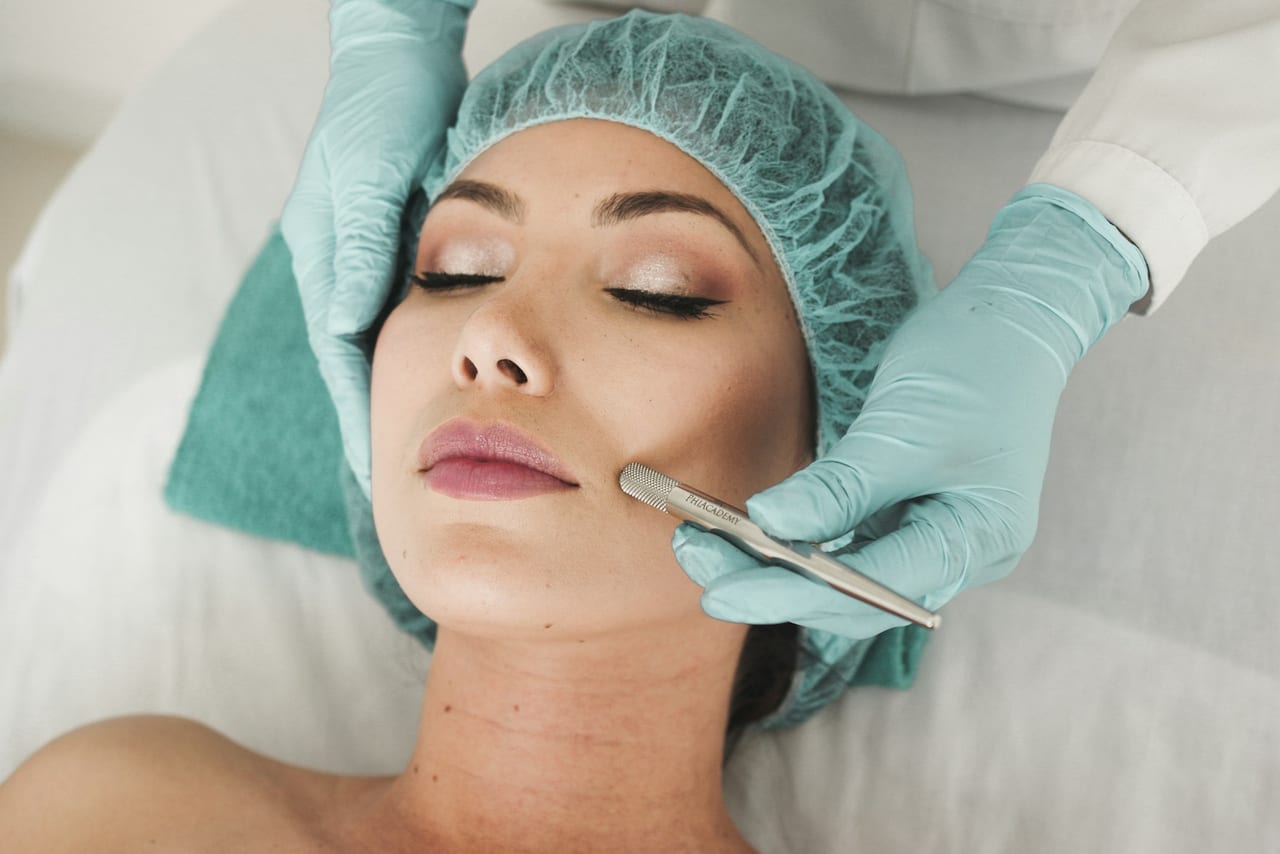 A patient receiving a non-surgical facial aesthetic treatment in a clinical setting