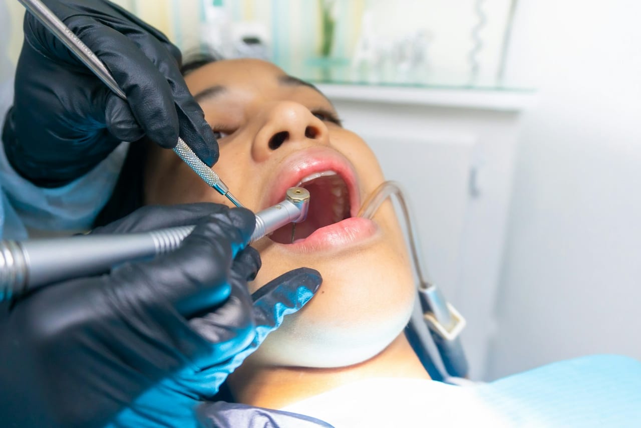A patient having a tooth restored during a routine appointment